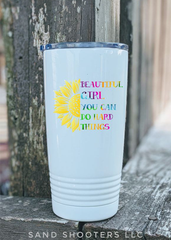 Photo of a white 20 oz tumbler with color printed image of a sunflower and text that reads "Beautiful girl, you can do hard things."